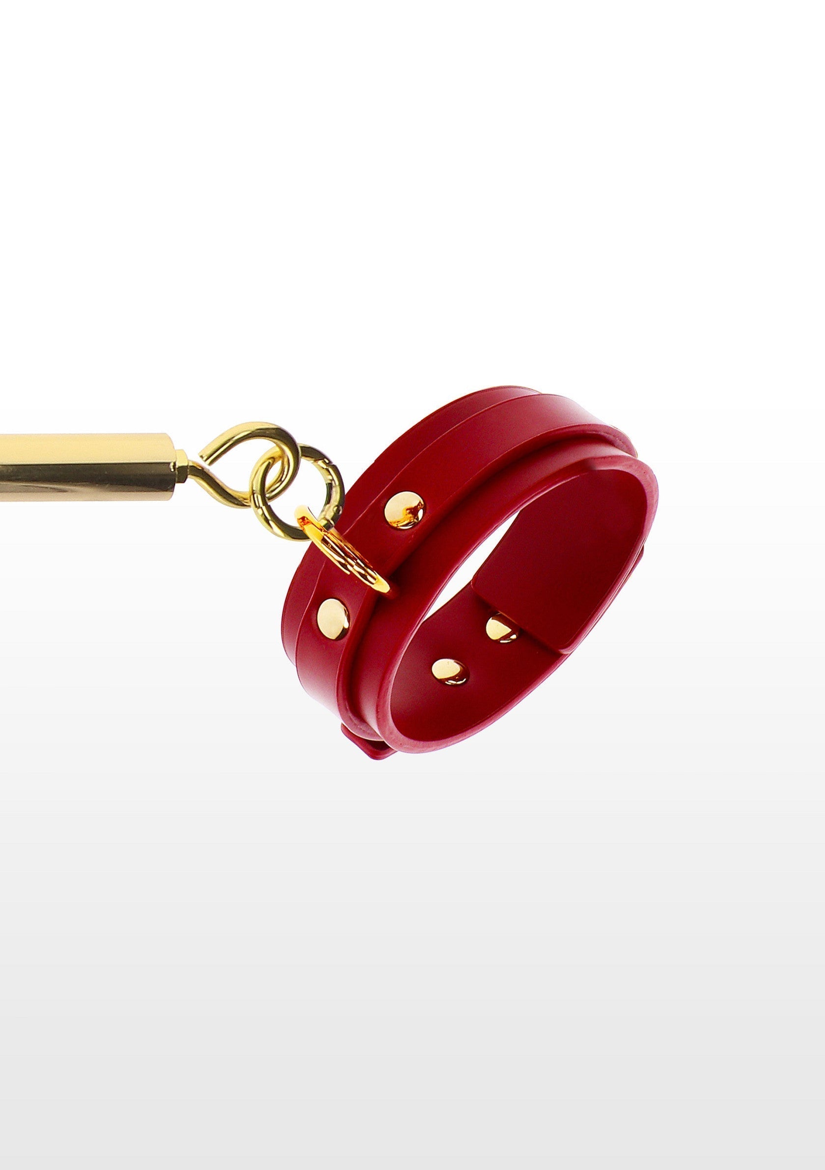 Barra divaricatrice con manette per caviglie rossa